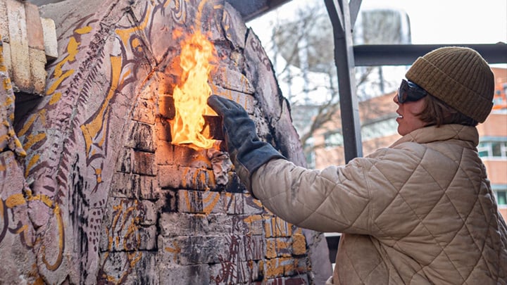 Student using fire to create artwork.