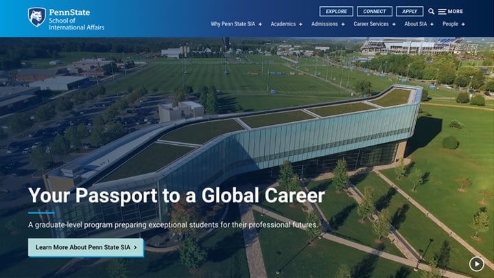 Screenshot of the Penn State School of International Affairs website with a background of aerial drone footage of the Law School's Katz Building